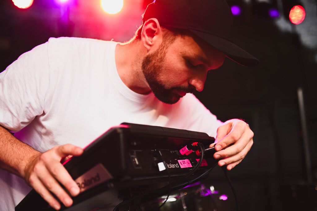 man plugging in keyboard